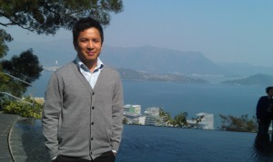 Daniel Chan, CUHK student adviser, at the serene Pavilion of Harmony pond on campus, overlooking Tolo Harbor. (photo by Dee Reid)