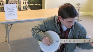 Try out a banjo in the banjo 'petting zoo.' (photo courtesy of Earl Scruggs Center)