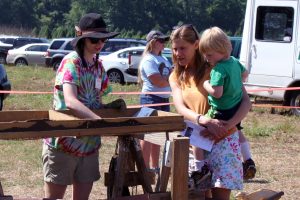 Visitors learn how to sift for artifacts at the annual Public Archaeology Day. (photo by Beth Lawrence)