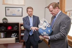 Guskiewicz shows off Carolina's helmet sensors to NFL Commissioner Roger Goodell in 2013. (Photo by Kevin Seifert Photography)