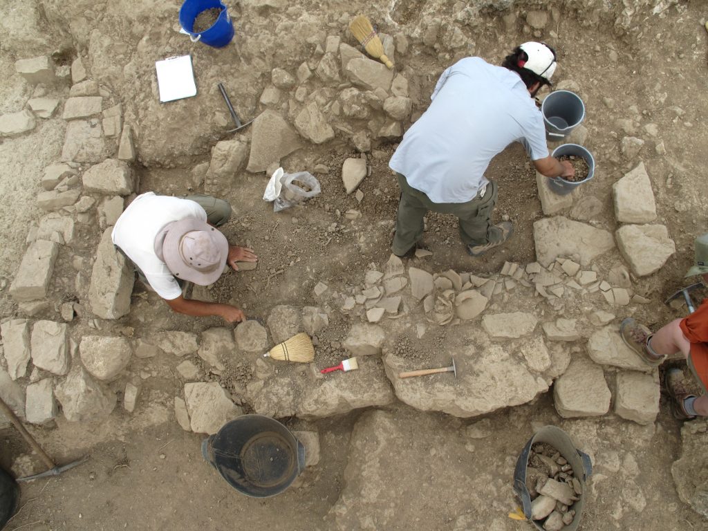 For 16 years, UNC researchers and students have led a large international archaeological team at Azoria, on the island of Crete. In this photo, you see an overhead view of people digging on the Azoria site.