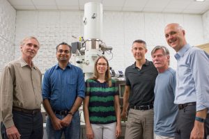Staff members Wallace Ambrose, Amar S. Kumbhar and Carrie Donley support the nanocomposites research of professors Theo Dingemans, Greg Forest and Peter Mucha —producing high-resolution images of carbon nanotubes embedded in crystalline polymer. They stand in front of equipment in the Chapel Hill Analytical and Nanofabrication Laboratory.