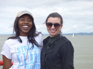Tiana Petree, left, shown with classmate Anna Baker, learned how much work goes into running a nonprofit. She waits with another student for the San Francisco Bay Cruise.