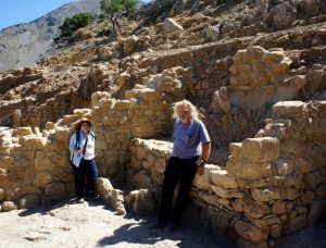 Professors Margaret Scarry and Donald Haggis take a break in an archaic (6th c. B.C.) storeroom of the West Building at Azoria. 