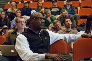 Bernard Bell watches student presentations in “Principles and Practice,” a course that focuses on core entrepreneurial skills including innovation, creative design, customer development and team dynamics.