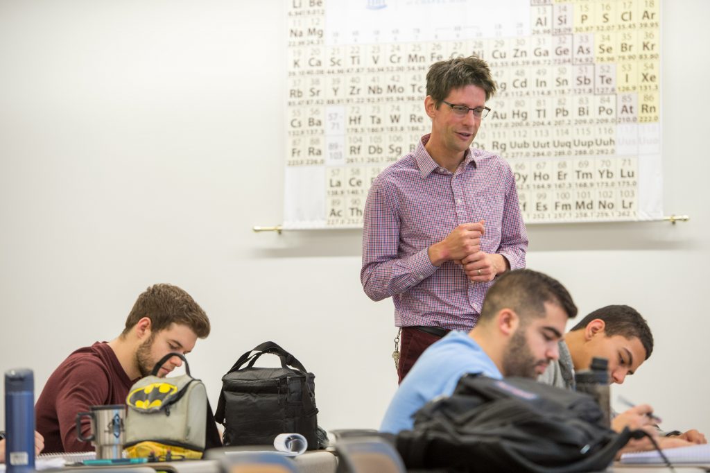 Chemistry department chair Jeffrey Johnson teaches graduate students in “Synthetic Organic Chemistry.” As the department celebrates its 200th birthday, he says “this is a pivotal time for Carolina chemistry.” (photo by Steve Exum)